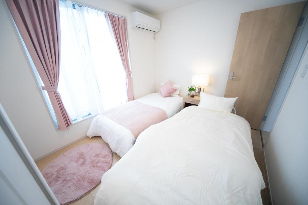 Postel nebo postele na pokoji v ubytování Nagashima Riverside Resort 2
