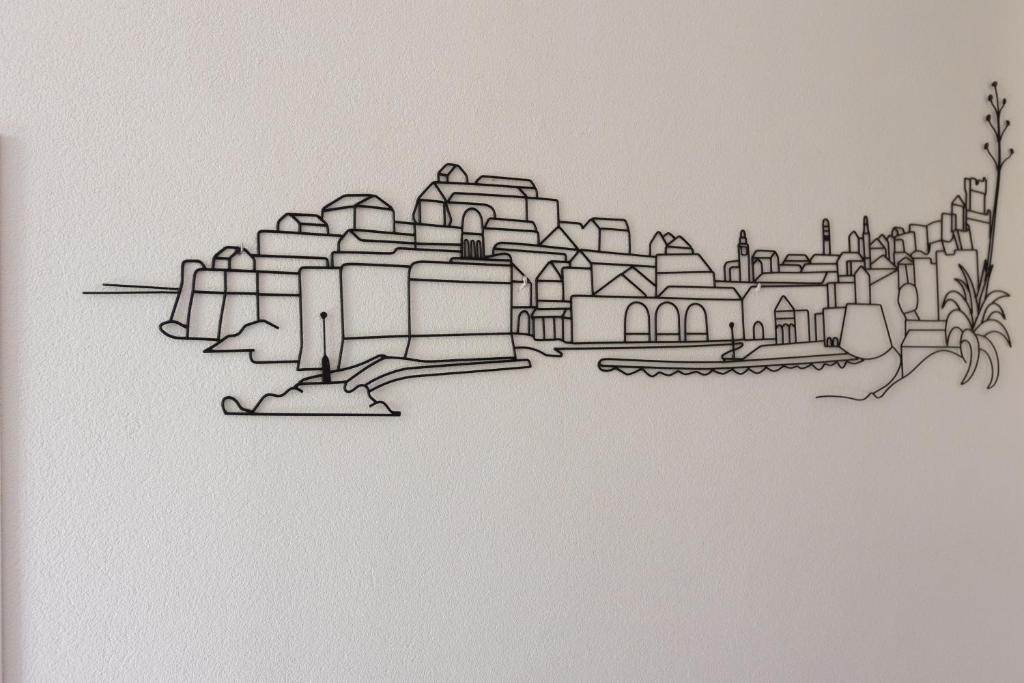 a drawing of a cityscape on a wall at Guest House Cinema close to port in Dubrovnik