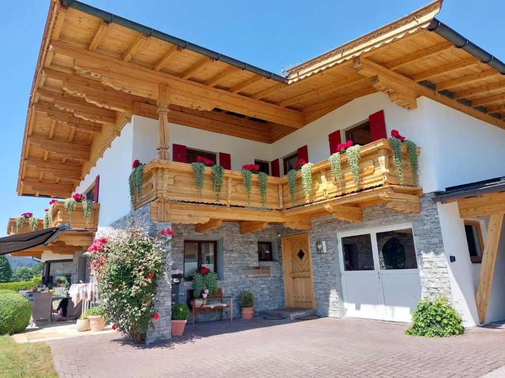 a wooden pergola on a house at Bergblick in Westendorf