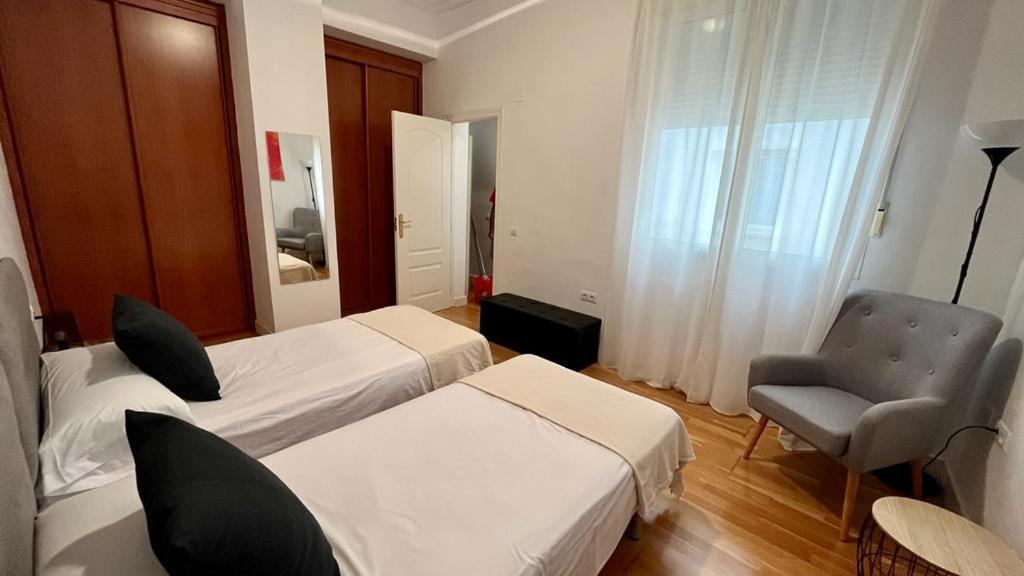 Posteľ alebo postele v izbe v ubytovaní Picassia Home Malaga Center