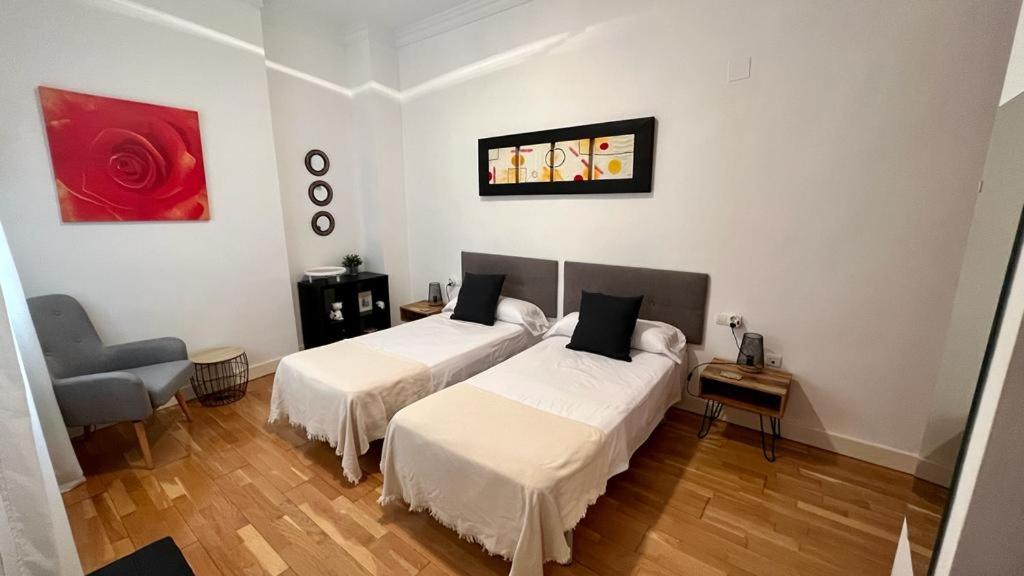 Posteľ alebo postele v izbe v ubytovaní Picassia Home Malaga Center