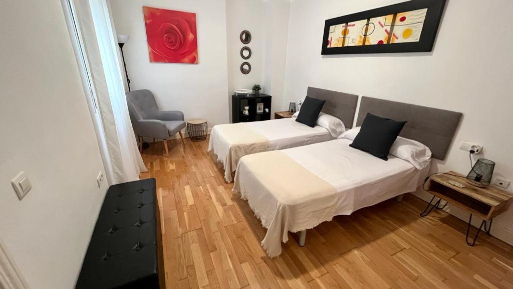 Posteľ alebo postele v izbe v ubytovaní Picassia Home Malaga Center