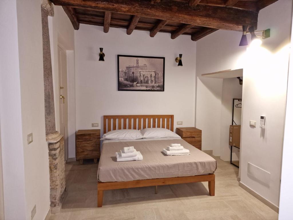 Ліжко або ліжка в номері Casina Giubbonari