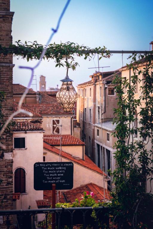 a street view of a city with a street light at Palazzo San Luca in Venice