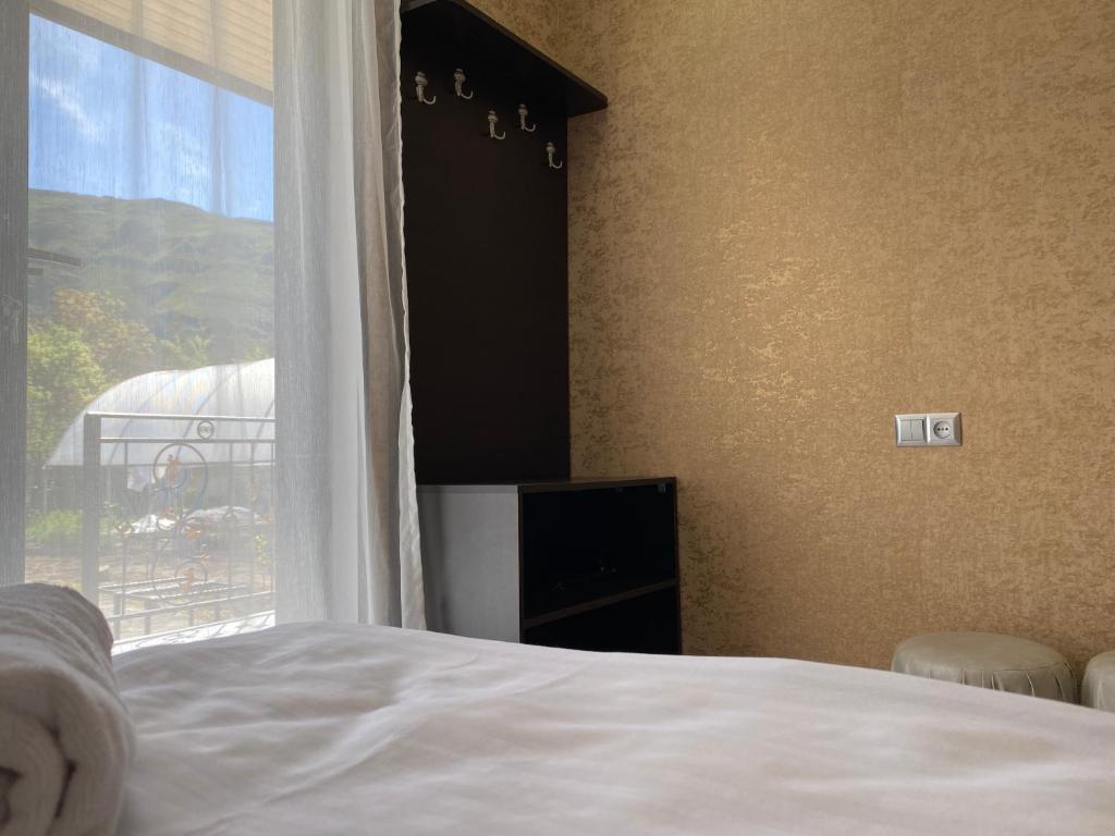 Postel nebo postele na pokoji v ubytování Hotel Tsiskari