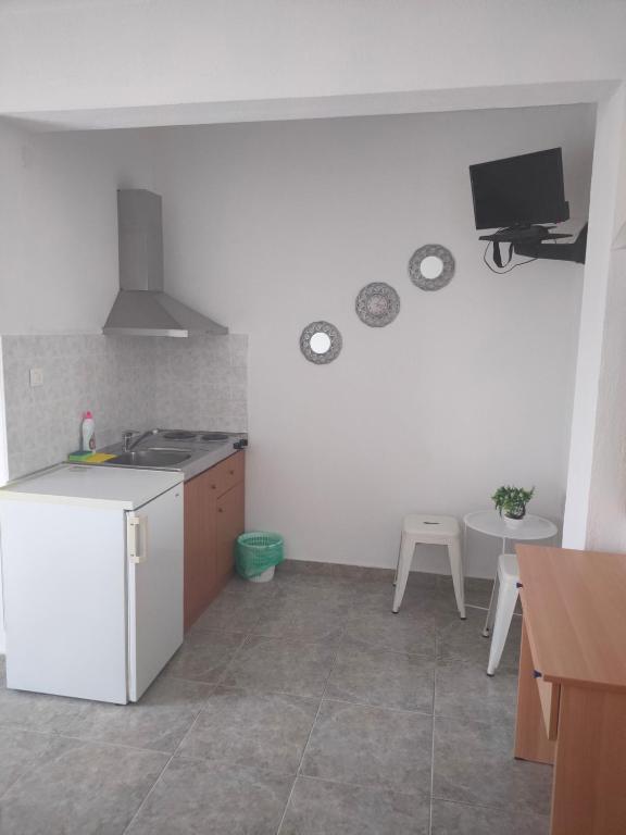 a kitchen with a sink and a stove top oven at Vigla House in Sykia Chalkidikis