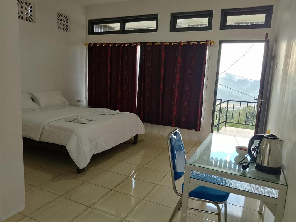 Postel nebo postele na pokoji v ubytování Sao Ria Wisata Lodge