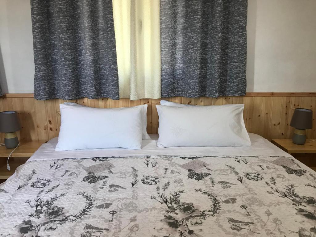 Postel nebo postele na pokoji v ubytování Vila ERI