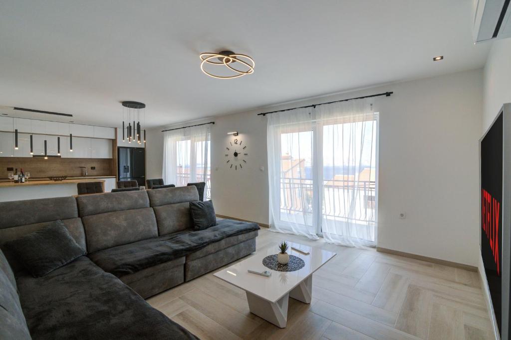 a living room with a couch and a table at FRANKO in Senj