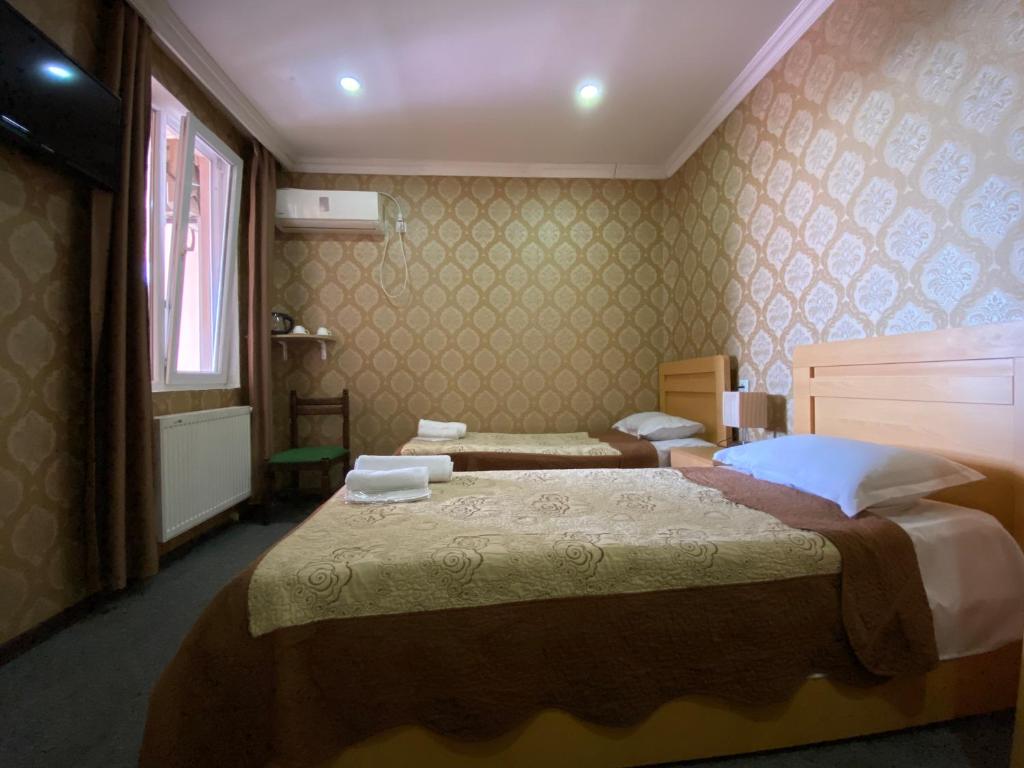 Postel nebo postele na pokoji v ubytování Hotel Shalimar