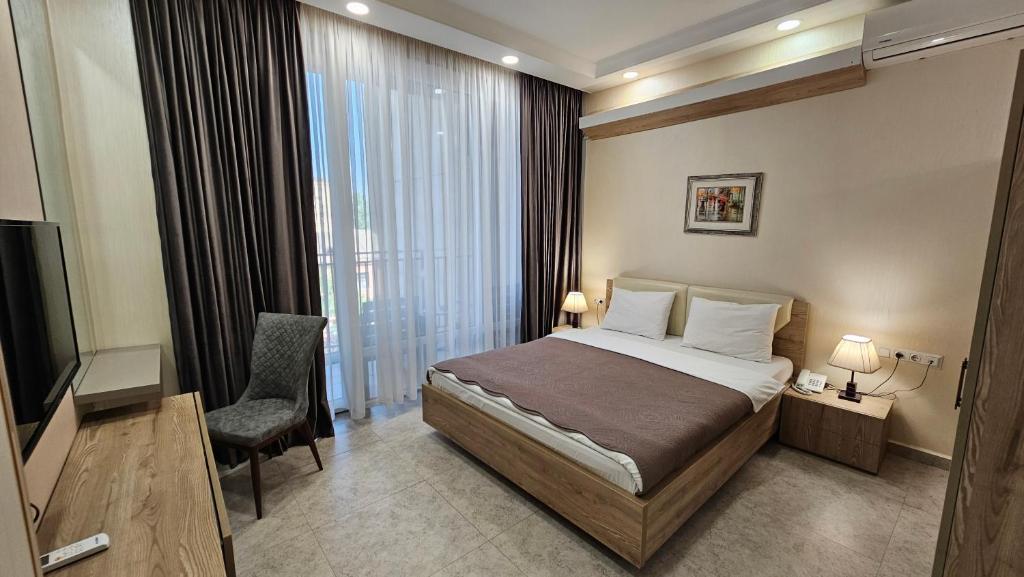 Postel nebo postele na pokoji v ubytování MD Apart Hotel Tbilisi