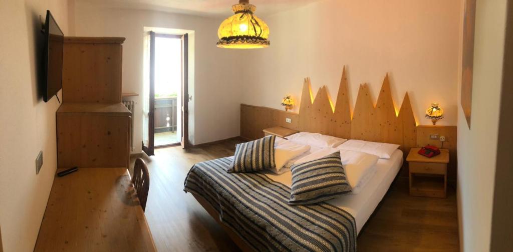 Postel nebo postele na pokoji v ubytování Hotel Bertoldi