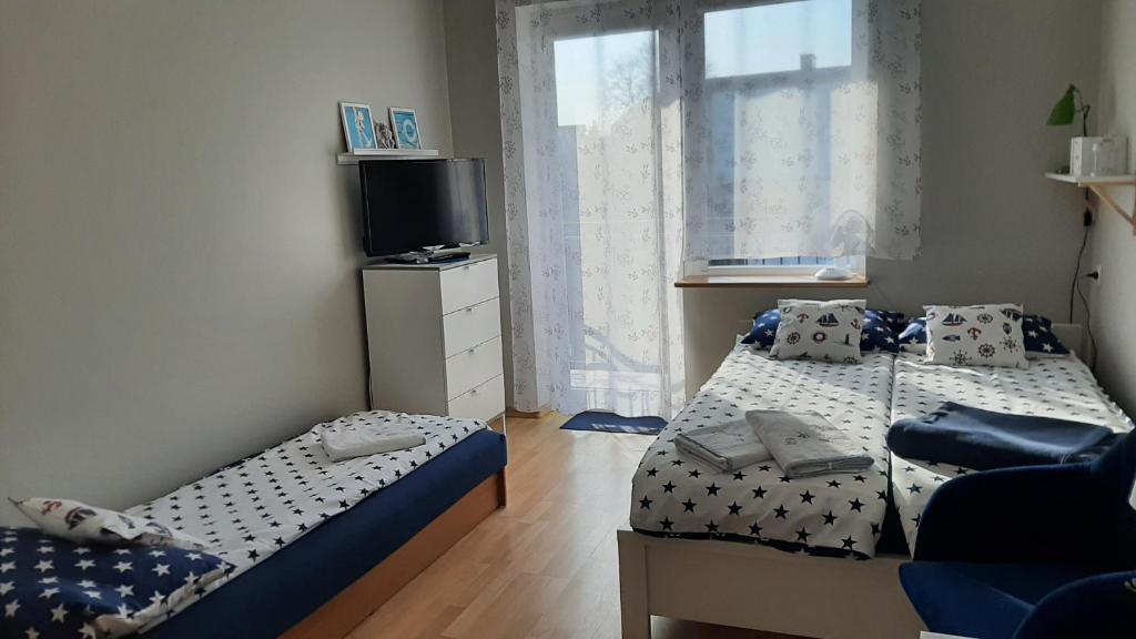 Posteľ alebo postele v izbe v ubytovaní Pokoje u Gosi