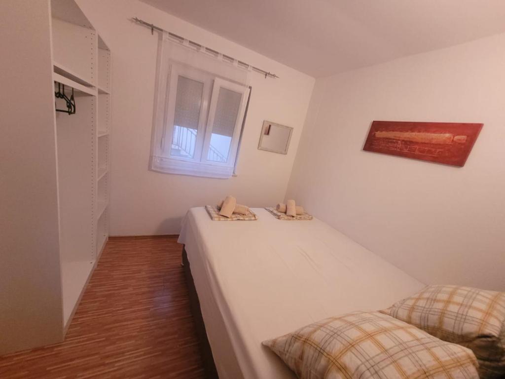 Postel nebo postele na pokoji v ubytování Apartments Matanovic
