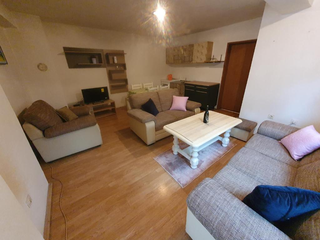 a living room with couches and a coffee table at Apartment Monika in Široki Brijeg