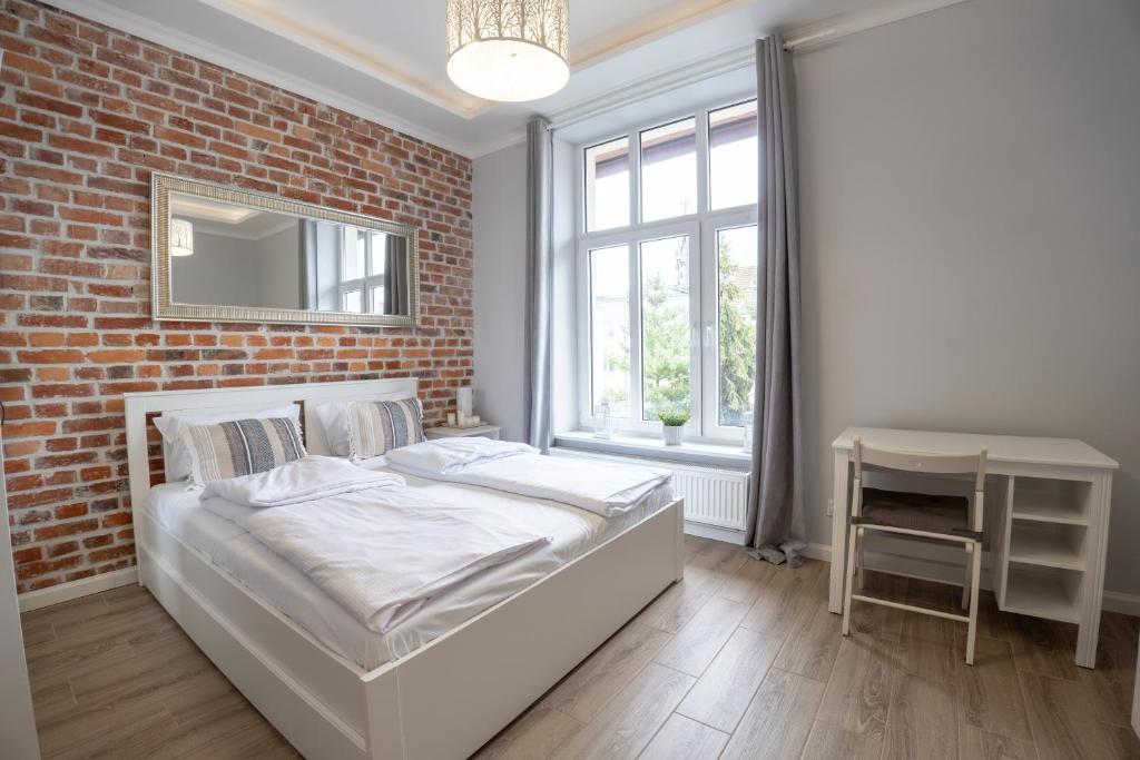 Ένα ή περισσότερα κρεβάτια σε δωμάτιο στο VIU Sobieskiego