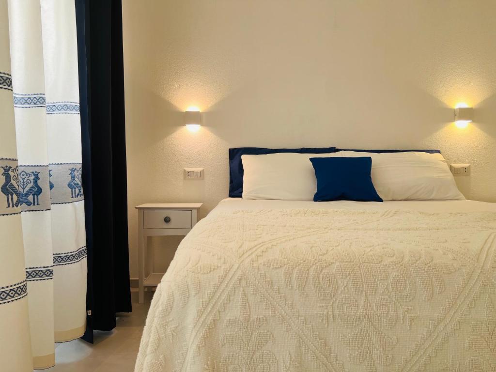 Postel nebo postele na pokoji v ubytování Via Giardini Rooms