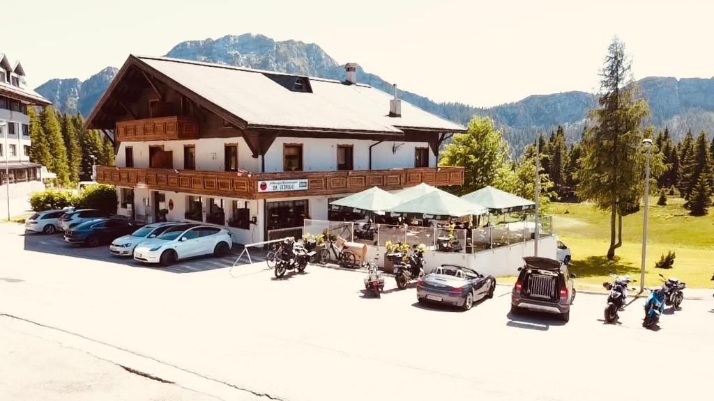 an overhead view of a building with motorcycles parked in front at Nassfeld Frühstückspension Wulfenia da Livio in Passo Pramollo