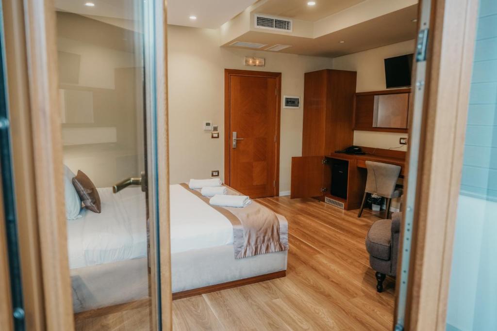 Postel nebo postele na pokoji v ubytování Center Hotel