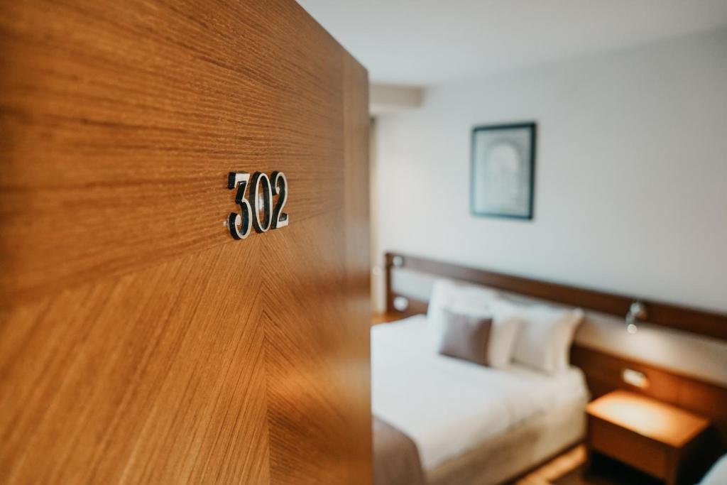 Postel nebo postele na pokoji v ubytování Center Hotel