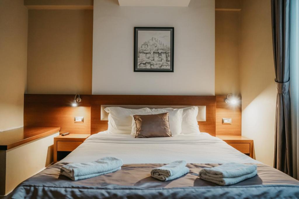 Postel nebo postele na pokoji v ubytování Center Hotel