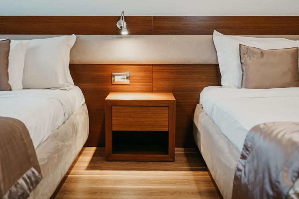 Postel nebo postele na pokoji v ubytování Center Hotel