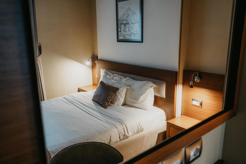 Postel nebo postele na pokoji v ubytování Center Hotel