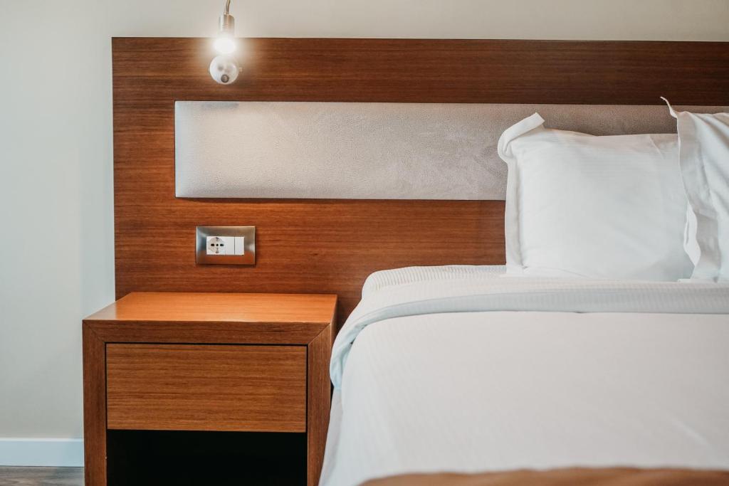Postel nebo postele na pokoji v ubytování Center Hotel