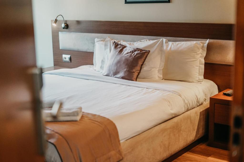Postel nebo postele na pokoji v ubytování Center Hotel