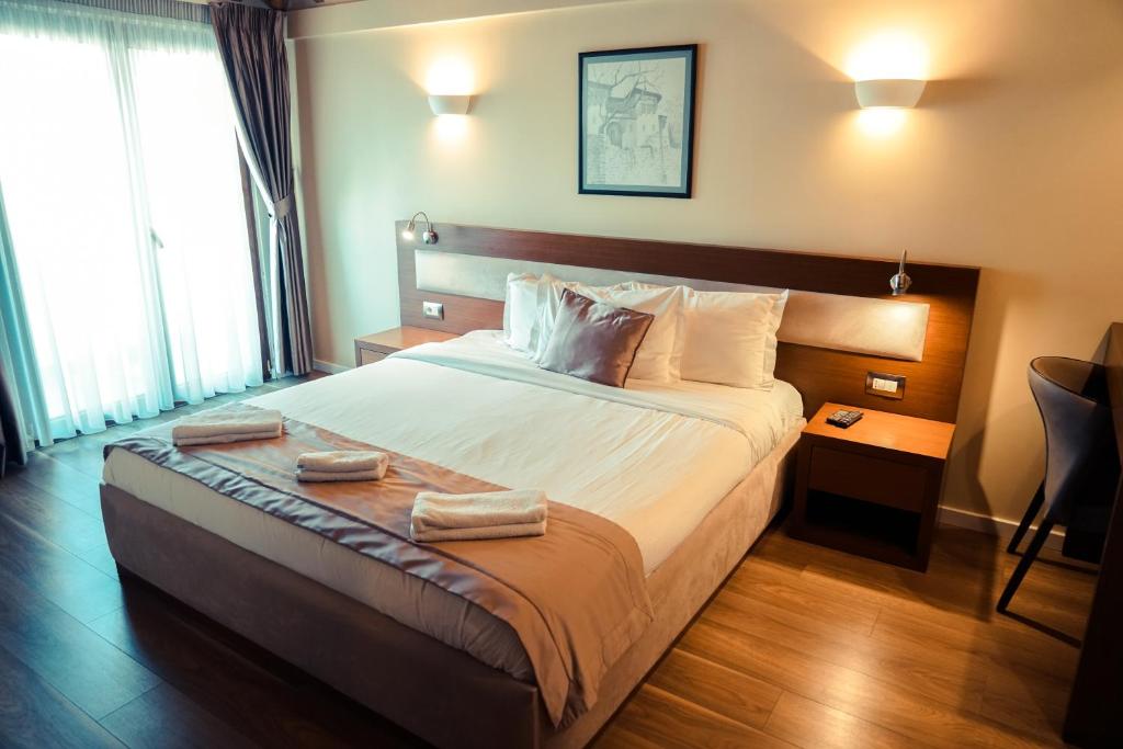 Postel nebo postele na pokoji v ubytování Center Hotel