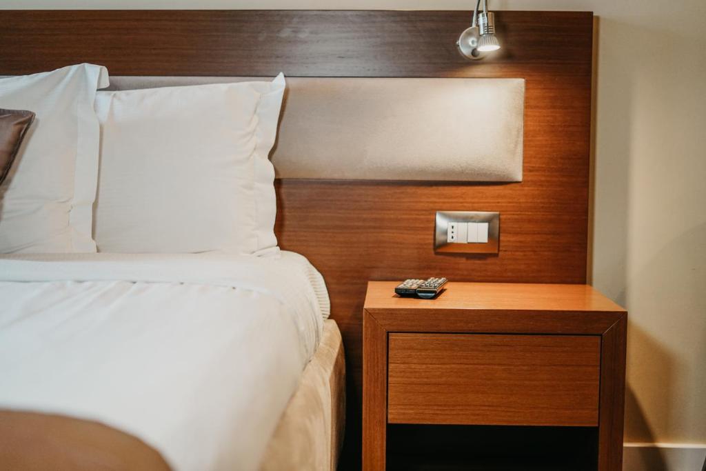 Postel nebo postele na pokoji v ubytování Center Hotel