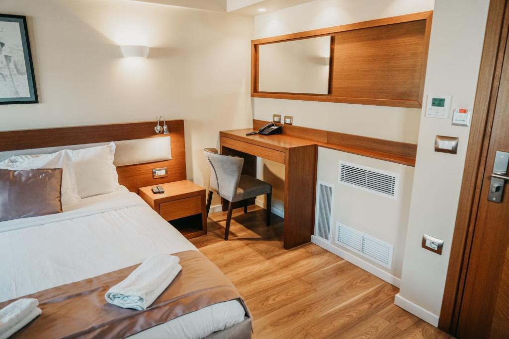 Postel nebo postele na pokoji v ubytování Center Hotel