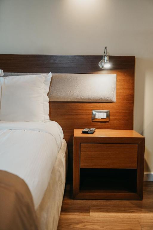 Postel nebo postele na pokoji v ubytování Center Hotel