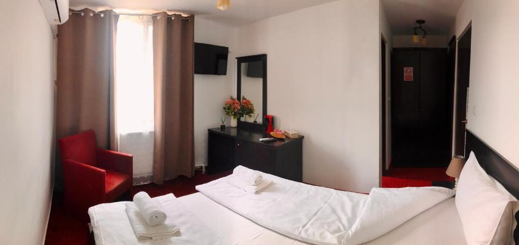Postel nebo postele na pokoji v ubytování Apartamente 9 - Naomi