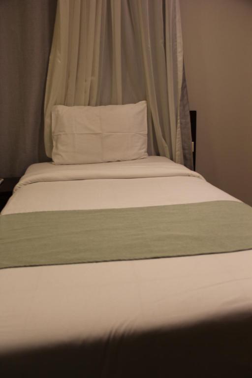 Postel nebo postele na pokoji v ubytování Elysees Hotel Tahrir Square