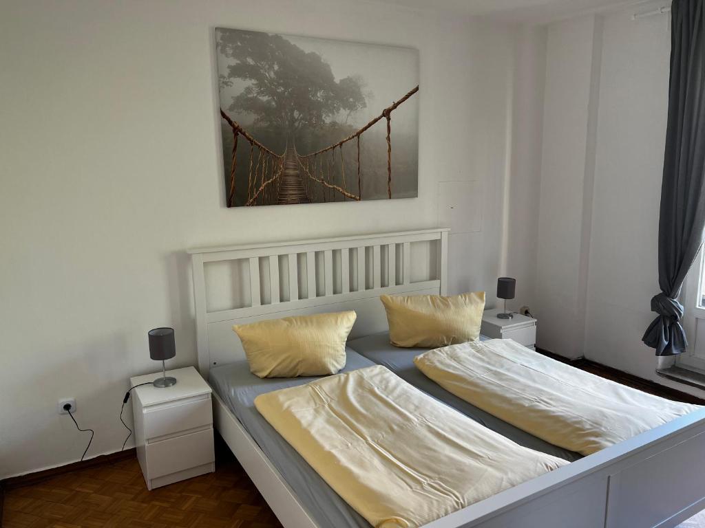 Postel nebo postele na pokoji v ubytování Hotel & Apartment Am Theaterplatz
