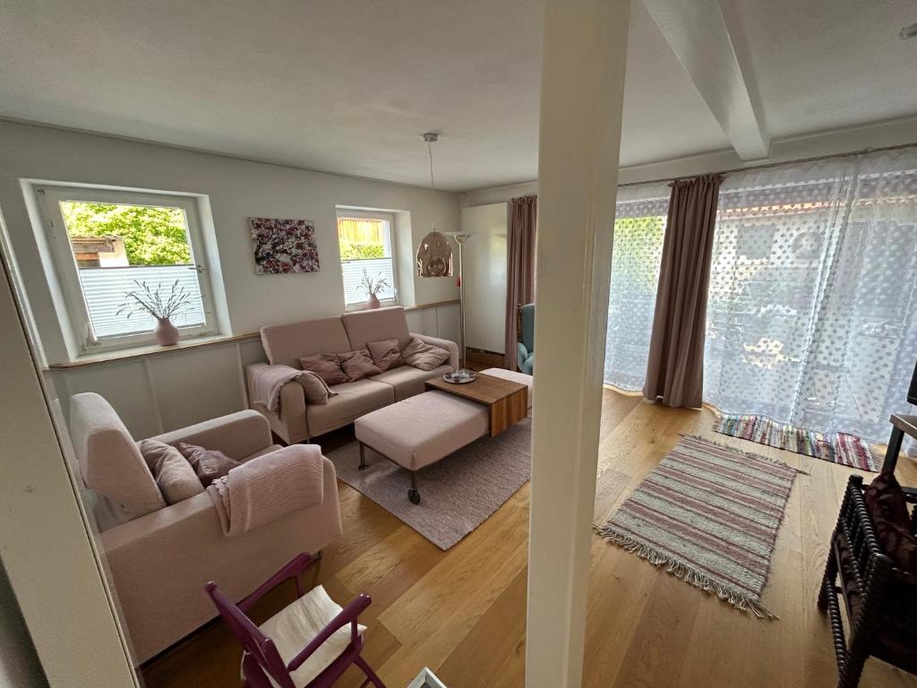 a living room with a couch and a table at Ferienhaus Maria in Walsdorf