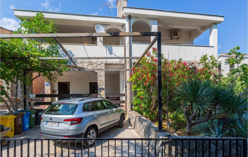 a car parked in front of a house at 2 Bedroom Lovely Apartment In Pinezici in Pinezici