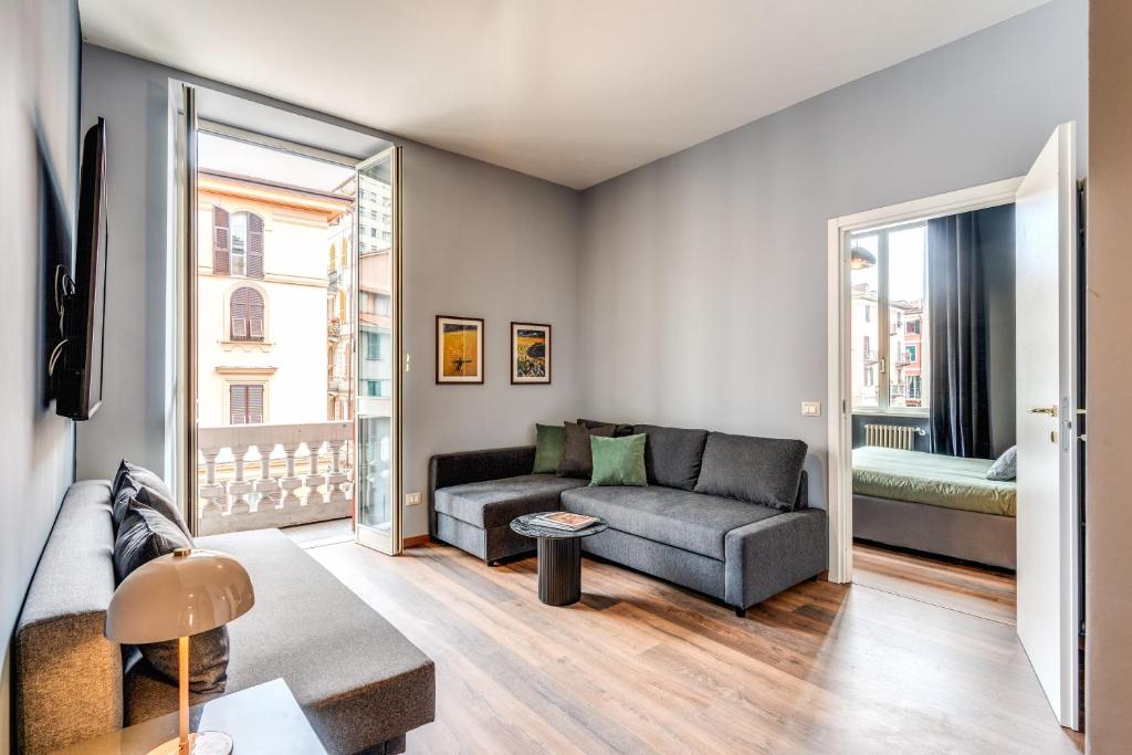 a living room with a couch and a window at Cinque Terre Dream in La Spezia