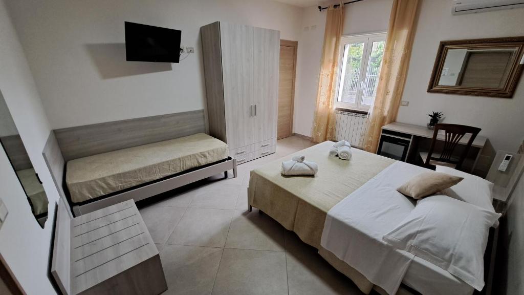 Postel nebo postele na pokoji v ubytování Hera Tropea Rooms