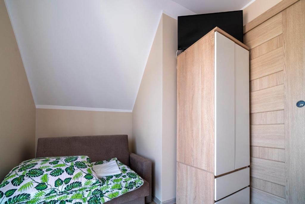 Postel nebo postele na pokoji v ubytování Szmaragdowe Morze