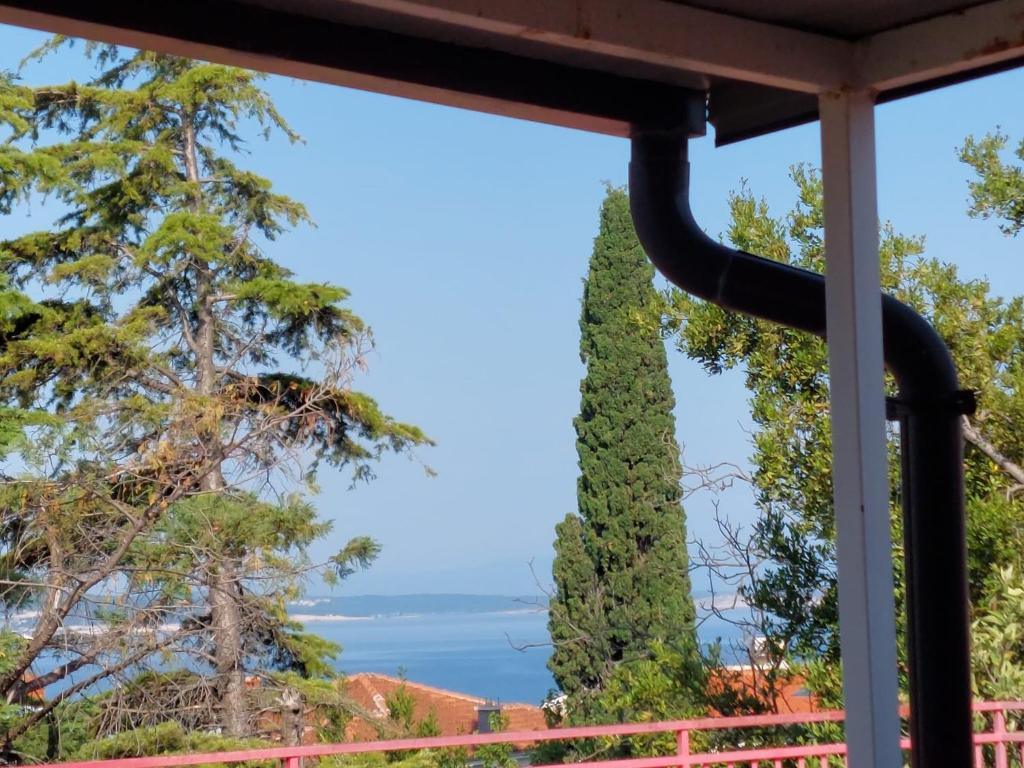 a view of the ocean from the porch of a house at House Marko in Selce