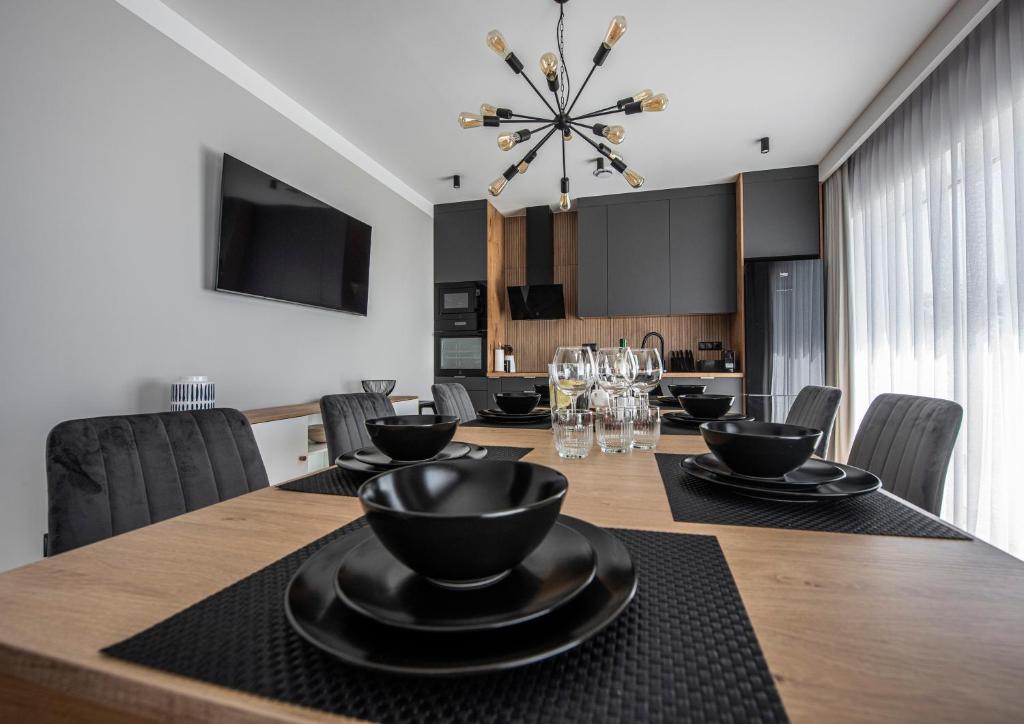 TV a/nebo společenská místnost v ubytování Lazur Apartamenty Domki