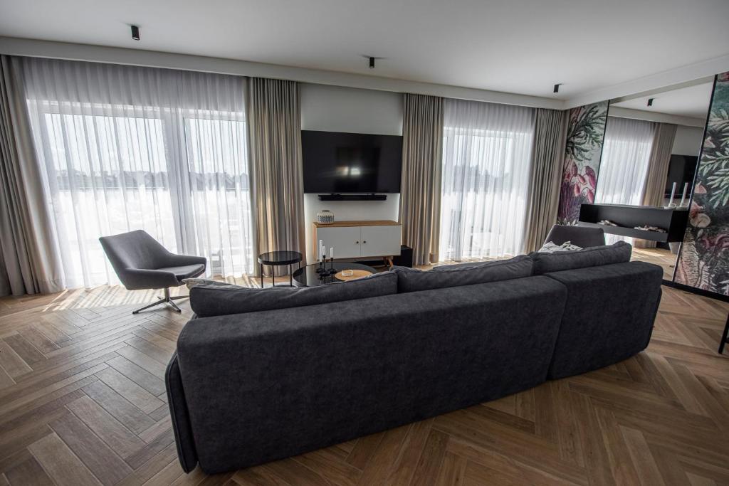 TV a/nebo společenská místnost v ubytování Lazur Apartamenty Domki