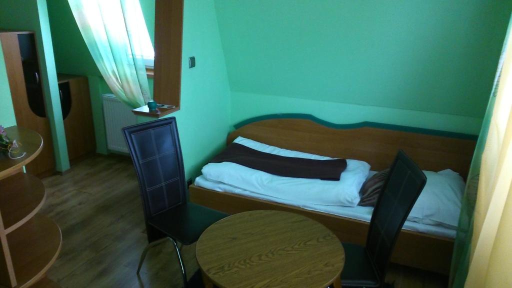 Postel nebo postele na pokoji v ubytování Penzión Rekrea