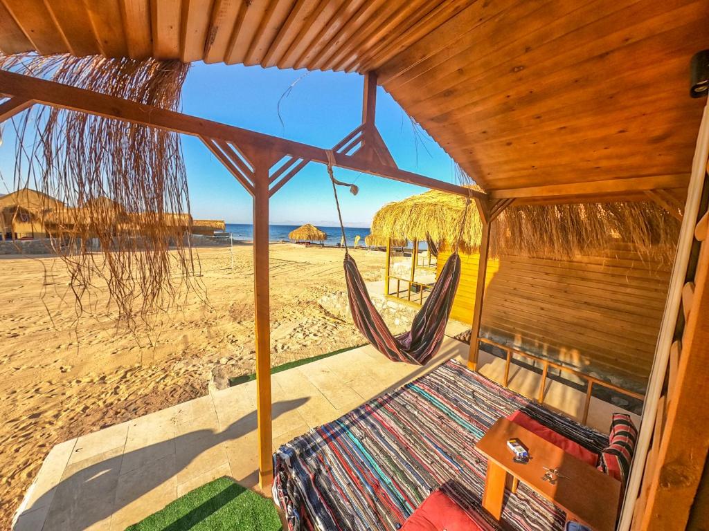 a room with a view of the beach at Flight Mode Camp in Nuweiba