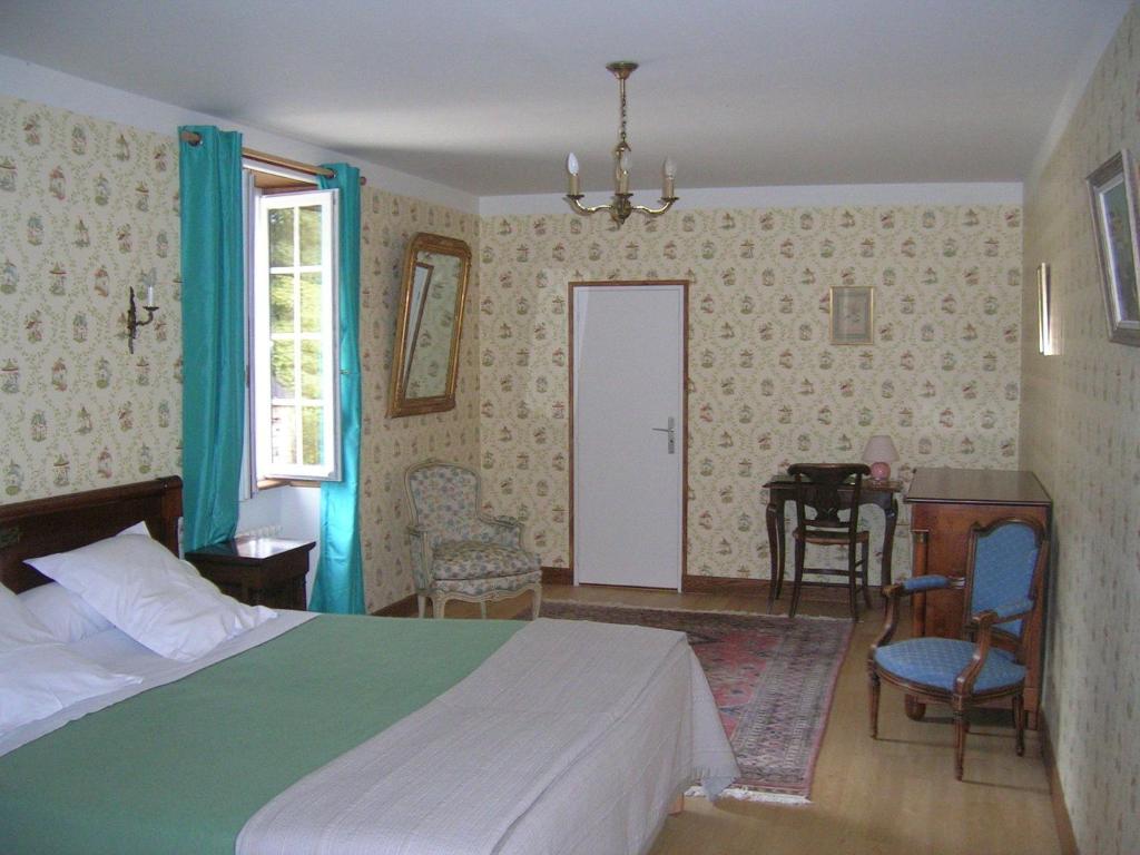Postel nebo postele na pokoji v ubytování Manoir Du Stang