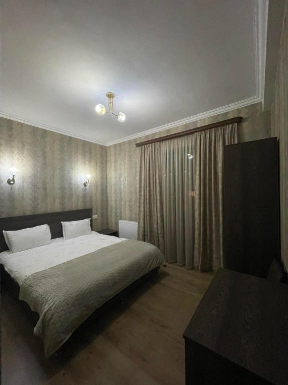 Postel nebo postele na pokoji v ubytování Hotel Shina