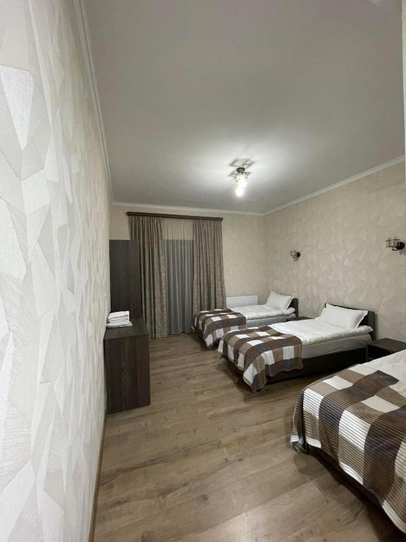 Postel nebo postele na pokoji v ubytování Hotel Shina