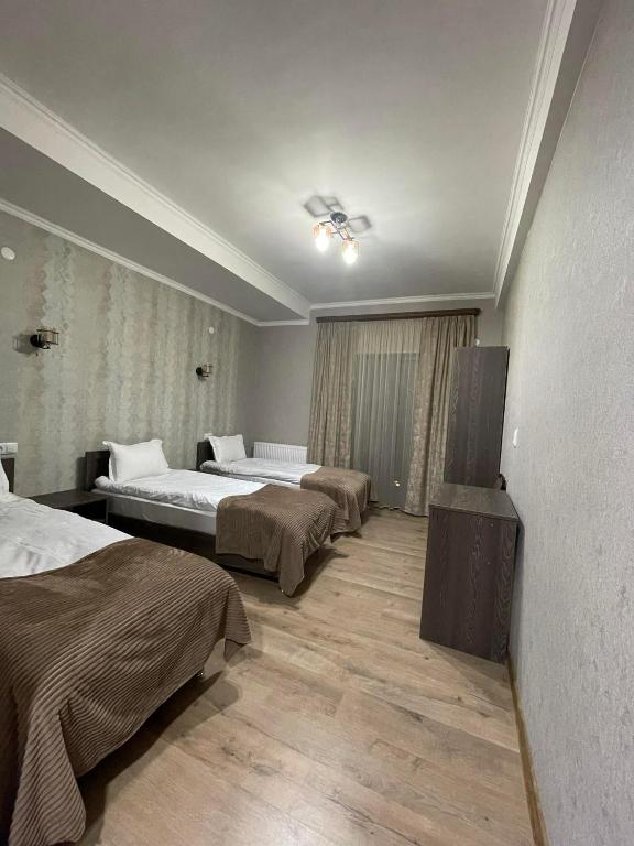 Postel nebo postele na pokoji v ubytování Hotel Shina